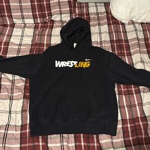 Black nike wrestling hoodie with gold and white letters